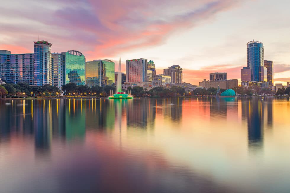 Resort Concierge Escapes Reviews highlights Orlando beyond theme parks with a downtown skyline and waterfront view.